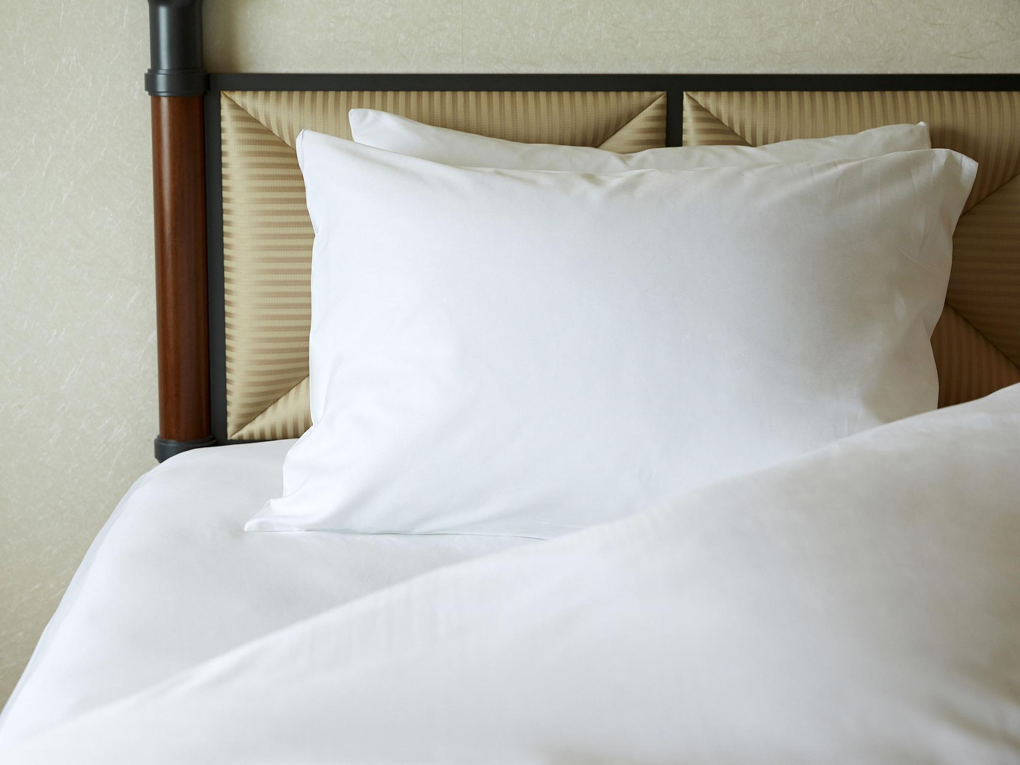 Miyako Hotel Gifu Nagaragawa Esterno foto A pillow on a bed